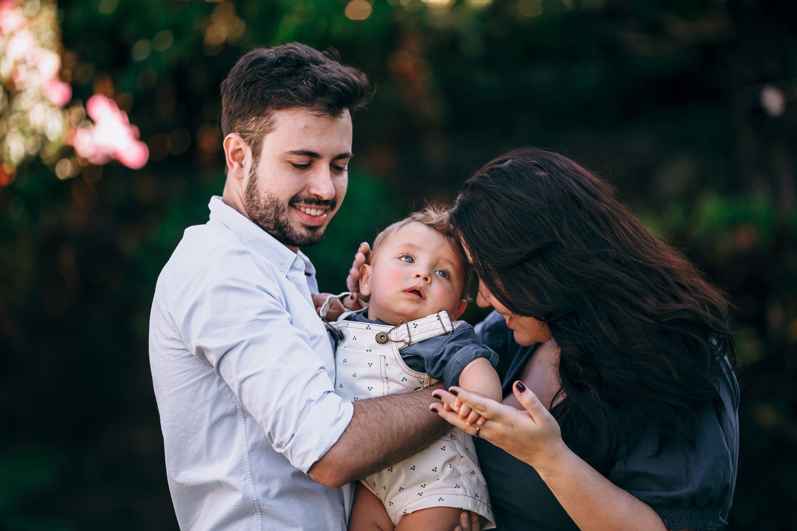 A joyful family enjoying a sunny day outdoors, capturing love and togetherness.